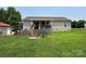 Back exterior with deck, walkout basement, and large backyard with shed at 1545 Lewis Farm Rd, Kings Mountain, NC 28086