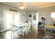 Cozy dining area with lots of light, wood floors, and a view to the laundry area at 1545 Lewis Farm Rd, Kings Mountain, NC 28086