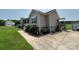 Exterior side view of home with an extended driveway, side porch, and lawn at 1545 Lewis Farm Rd, Kings Mountain, NC 28086