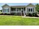 Charming one-story home features a welcoming front porch and neatly landscaped front yard at 1545 Lewis Farm Rd, Kings Mountain, NC 28086