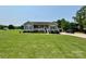 Charming ranch-style home with a covered front porch, detached garage and expansive yard at 1545 Lewis Farm Rd, Kings Mountain, NC 28086