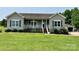 Charming ranch-style home with a covered front porch and mature landscaping at 1545 Lewis Farm Rd, Kings Mountain, NC 28086