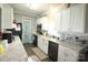 Bright kitchen with white cabinets, granite countertops, and stainless steel appliances at 1545 Lewis Farm Rd, Kings Mountain, NC 28086