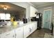 Bright kitchen with granite counters, white cabinets, and a pantry door at 1545 Lewis Farm Rd, Kings Mountain, NC 28086