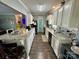 Open-concept kitchen with granite countertops, white cabinets, and stainless steel appliances at 1545 Lewis Farm Rd, Kings Mountain, NC 28086