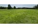Expansive grassy field, offering open space and potential for various uses at 1545 Lewis Farm Rd, Kings Mountain, NC 28086