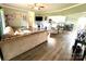 Open-concept living room with wood floors, neutral decor, and abundant natural light at 1545 Lewis Farm Rd, Kings Mountain, NC 28086