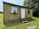 Exterior view of small wooden shed with a single door and an air conditioner at 1545 Lewis Farm Rd, Kings Mountain, NC 28086