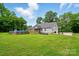 The backyard offers a relaxing above ground pool, patio, and well manicured lawn at 1621 California Rd, York, SC 29745