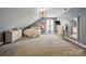 The expansive bedroom features a makeup table, dresser, television and plush carpet at 1621 California Rd, York, SC 29745