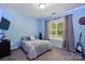 The light blue bedroom features calming decor, providing a serene and peaceful atmosphere at 1621 California Rd, York, SC 29745