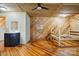 Rustic bedroom with wood walls, a ceiling fan, a vanity, and a new bed frame at 1621 California Rd, York, SC 29745