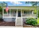 Inviting front porch with American flag, offering a relaxing outdoor space at 1621 California Rd, York, SC 29745