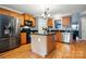 Modern kitchen featuring stainless steel appliances, a center island with black countertop, and wood cabinets at 1621 California Rd, York, SC 29745