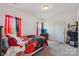 Comfortable bedroom with neutral carpet, natural light, and red and black bedding at 1770 Troon Dr, Salisbury, NC 28144