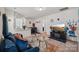 Bright living area with open flow to kitchen, perfect for entertaining, featuring a modern sofa and decor at 1770 Troon Dr, Salisbury, NC 28144