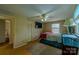 Spacious bedroom with hardwood floors, a ceiling fan, and a view of the neighborhood at 1867 Shannon Dr, Conover, NC 28613
