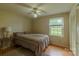 Cozy bedroom with hardwood floors, a ceiling fan, and a view of the neighborhood at 1867 Shannon Dr, Conover, NC 28613