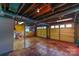 Spacious garage with yellow walls and an automatic door, perfect for parking and storage at 1867 Shannon Dr, Conover, NC 28613
