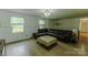 Comfortable living room featuring hardwood floors and abundant natural light through large windows at 1867 Shannon Dr, Conover, NC 28613