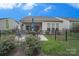Fenced backyard with patio, seating, and well-maintained lawn, perfect for outdoor activities at 19182 Mallard Dr, Fort Mill, SC 29707