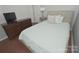 Cozy bedroom with hardwood floors, and a dresser and TV, creating a relaxing personal space at 19182 Mallard Dr, Fort Mill, SC 29707