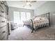 Spacious bedroom with a comfortable bed, dresser, and ample natural light from the windows at 19182 Mallard Dr, Fort Mill, SC 29707