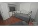 Functional bedroom with a desk, daybed, and hardwood floors, creating a versatile living space at 19182 Mallard Dr, Fort Mill, SC 29707