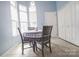 Bright breakfast nook with tile flooring and a charming table setting near large windows at 19182 Mallard Dr, Fort Mill, SC 29707