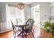 Cozy dining room featuring a round table, classic chandelier, and natural light from the large window at 19182 Mallard Dr, Fort Mill, SC 29707