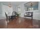 Well-lit dining room featuring hardwood floors and an open view into the modern kitchen at 19182 Mallard Dr, Fort Mill, SC 29707