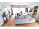 Comfortable living room featuring hardwood floors, a plush sofa, and access to the outdoor patio at 19182 Mallard Dr, Fort Mill, SC 29707