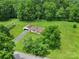 Charming home with attached garage on a beautiful lot surrounded by lush green trees and lawn at 2084 Old Evans Cir, Lancaster, SC 29720