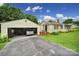 Side view of a charming home with a detached garage, offering convenience and curb appeal at 2084 Old Evans Cir, Lancaster, SC 29720