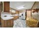 Functional kitchen with wood-paneled walls, laminate countertops, and tiled flooring at 2084 Old Evans Cir, Lancaster, SC 29720