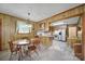 Eat-in kitchen with wood paneling, tile floors, and updated appliances at 2084 Old Evans Cir, Lancaster, SC 29720