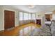 Bright living room with hardwood floors, a decorative fireplace, and large windows providing natural light at 2084 Old Evans Cir, Lancaster, SC 29720