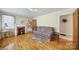 Comfortable living room featuring hardwood floors, a fireplace, and a cozy sofa arrangement at 2084 Old Evans Cir, Lancaster, SC 29720