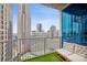 City balcony with artificial turf, outdoor seating, and stunning city views at 210 N Church St # 2807, Charlotte, NC 28202