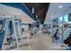 Spacious gym featuring modern cardio equipment, weight machines, and plenty of natural light at 210 N Church St # 2807, Charlotte, NC 28202