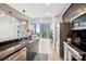 Modern kitchen features stainless steel appliances, sleek black cabinetry, and a stunning city view at 210 N Church St # 2807, Charlotte, NC 28202