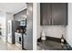 Well-equipped kitchen with stainless steel appliances, modern cabinetry, and countertop bar area at 210 N Church St # 2807, Charlotte, NC 28202