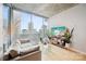 Sun-filled living room with modern decor, a large window showcasing city views, and stylish furniture at 210 N Church St # 2807, Charlotte, NC 28202