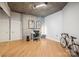 Bright office space with concrete wall, hardwood floors, modern decor, and ample natural light at 210 N Church St # 2807, Charlotte, NC 28202