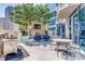 Beautiful outdoor patio with grill, fireplace, TV, and seating with city views at 210 N Church St # 2807, Charlotte, NC 28202