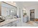 A bright bathroom boasts double sinks, granite countertops, and a large mirror for a spa-like experience at 21039 Running Creek Dr # 8, Locust, NC 28097