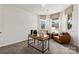 Cozy flex space featuring comfortable seating, a stylish desk, and natural light from two windows at 21039 Running Creek Dr # 8, Locust, NC 28097