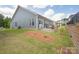Spacious backyard featuring a lush green lawn, patio area, and privacy fence at 215 Pintail Dr, Monroe, NC 28110