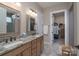 Bathroom featuring double sinks, granite countertops, and walk-in closet at 215 Pintail Dr, Monroe, NC 28110