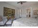Comfortable bedroom with ceiling fan, neutral décor, and ensuite bathroom at 215 Pintail Dr, Monroe, NC 28110